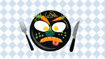 Tecknad humoristisk bild av en tallrik med mat. Korv, ägg och grönsaker är upplagda så att de formar ett argt ansikte. 